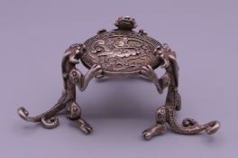 A Chinese miniature silver fo dog table. 4 cm high.