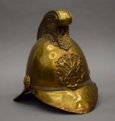 A vintage brass fireman's helmet. 26 cm high.