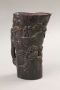 A libation cup. 17.5 cm high.