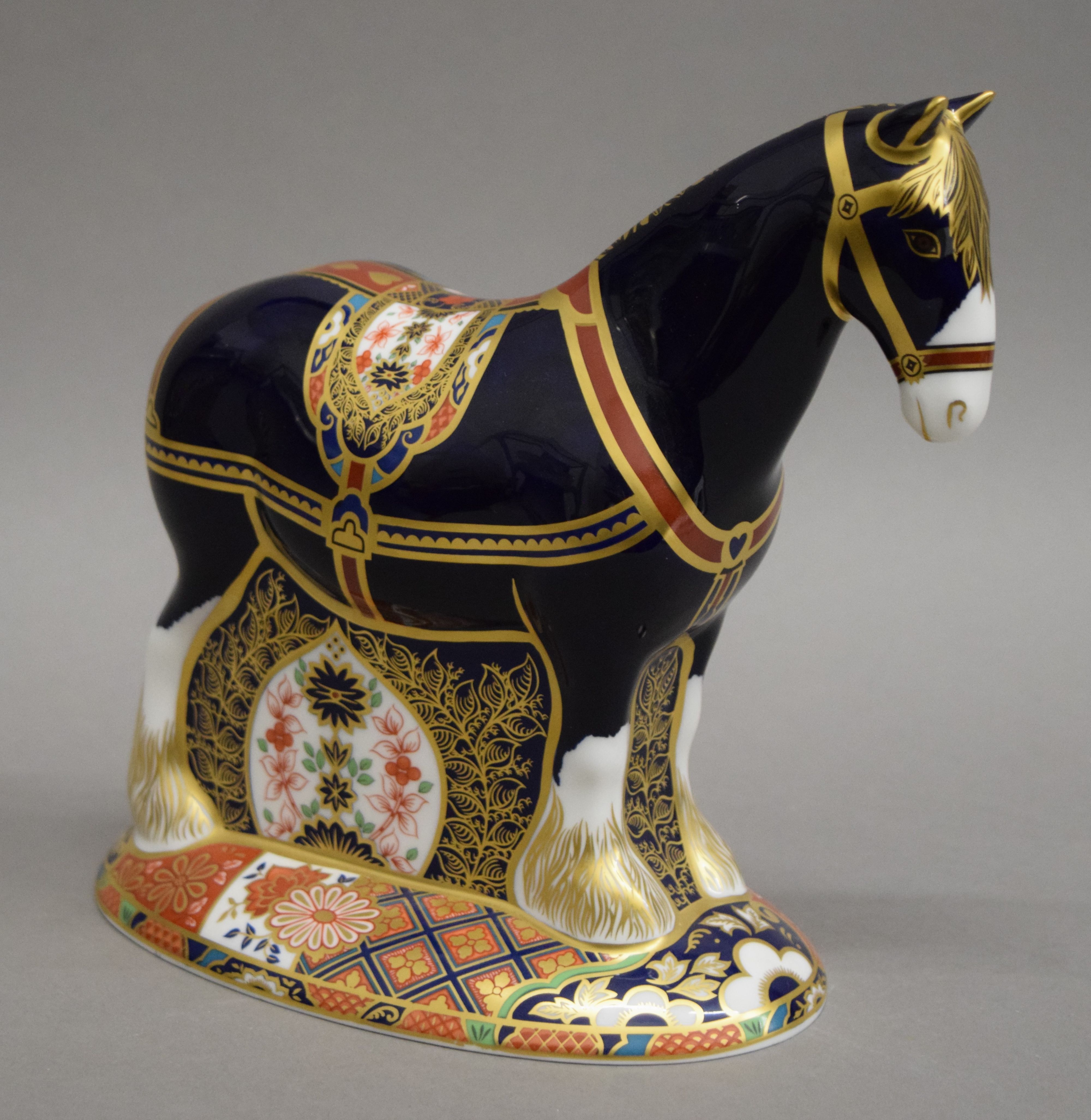 A Royal Crown Derby limited edition shire horse paperweight. 19 cm high.