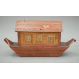 A painted wooden model of Noah's Ark. 40 cm long.