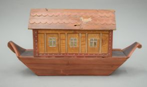 A painted wooden model of Noah's Ark. 40 cm long.