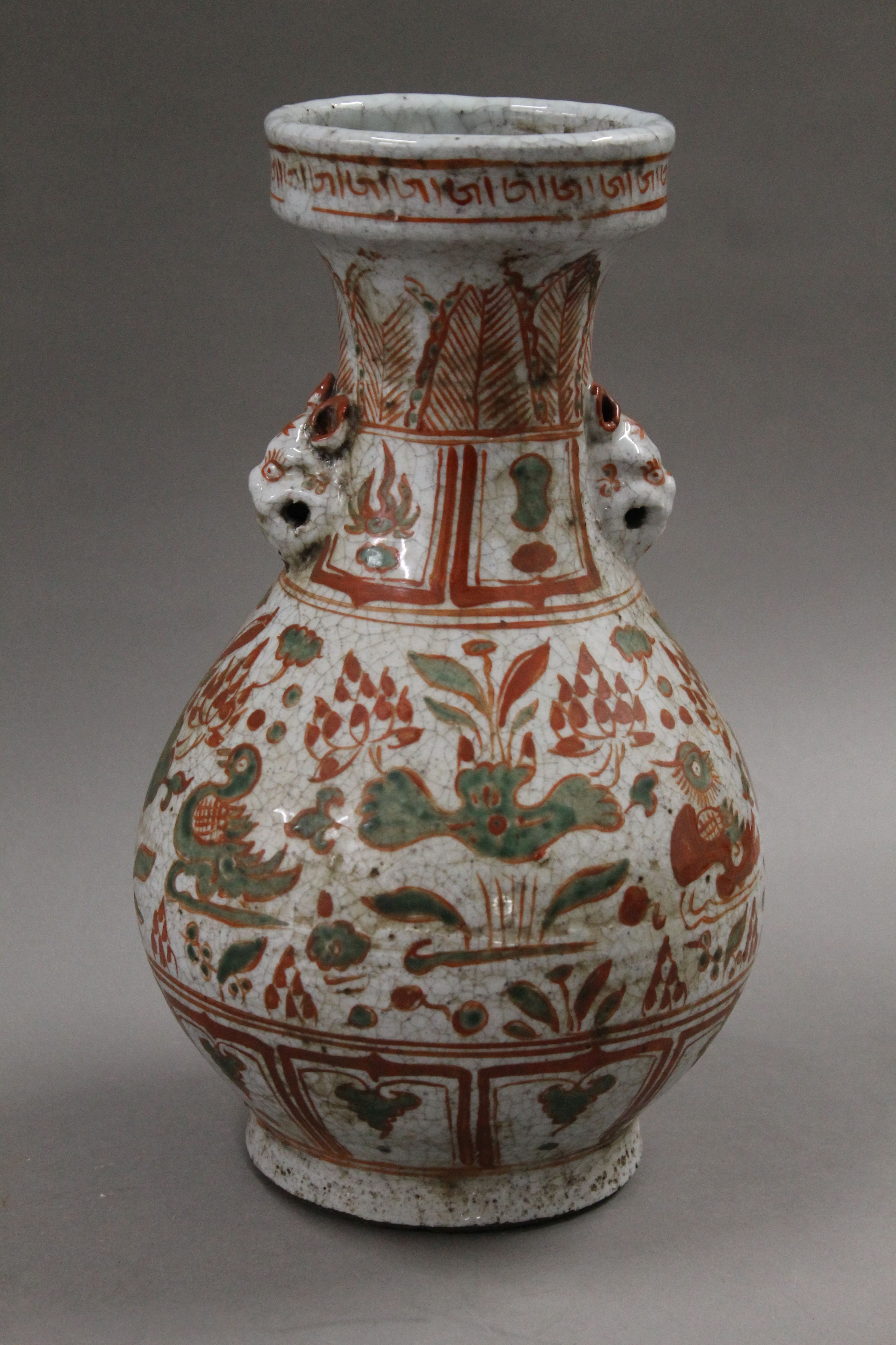 A Chinese red and green decorated porcelain vase. 31 cm high.