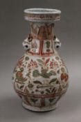 A Chinese red and green decorated porcelain vase. 31 cm high.