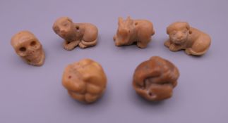 A set of six carved bone netsuke. Each approximately 2.5 cm wide.