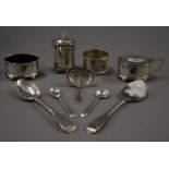 A cased silver cruet set, spoons and a napkin ring. 167.8 grammes.