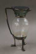 A Christopher Dresser style silver plate mounted claret jug. 25 cm high.