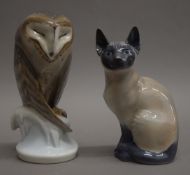 A Royal Copenhagen cat and a Royal Copenhagen owl. The latter 22 cm high.