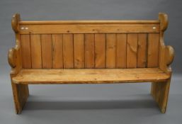 A Victorian pine pew. 149 cm long, 47 cm deep, 92 cm high.