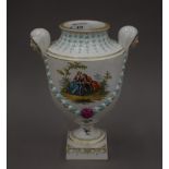 A finely painted 19th century German porcelain vase with mask handles, Augustus Rex mark (Wolfson).