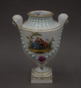 A finely painted 19th century German porcelain vase with mask handles, Augustus Rex mark (Wolfson).