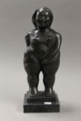 A bronze model of a nude voluptuous female. 36 cm high.