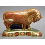 A Royal Crown Derby limited edition Harrods bull paperweight. 12 cm high.