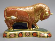 A Royal Crown Derby limited edition Harrods bull paperweight. 12 cm high.