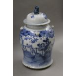 A 19th century Chinese blue and white porcelain lidded jar. 46 cm high.