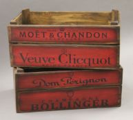 A pair of red champagne boxes.