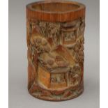 A Chinese carved bamboo brush pot. 17 cm high.