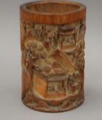 A Chinese carved bamboo brush pot. 17 cm high.