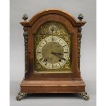 A Victorian walnut mantle clock. 34.5 cm high.