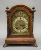 A Victorian walnut mantle clock. 34.5 cm high.