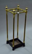 A Victorian brass and iron stick stand. 61 cm high.