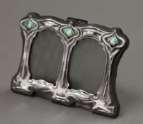 An Art Nouveau style silver double photograph frame. 11 cm wide.