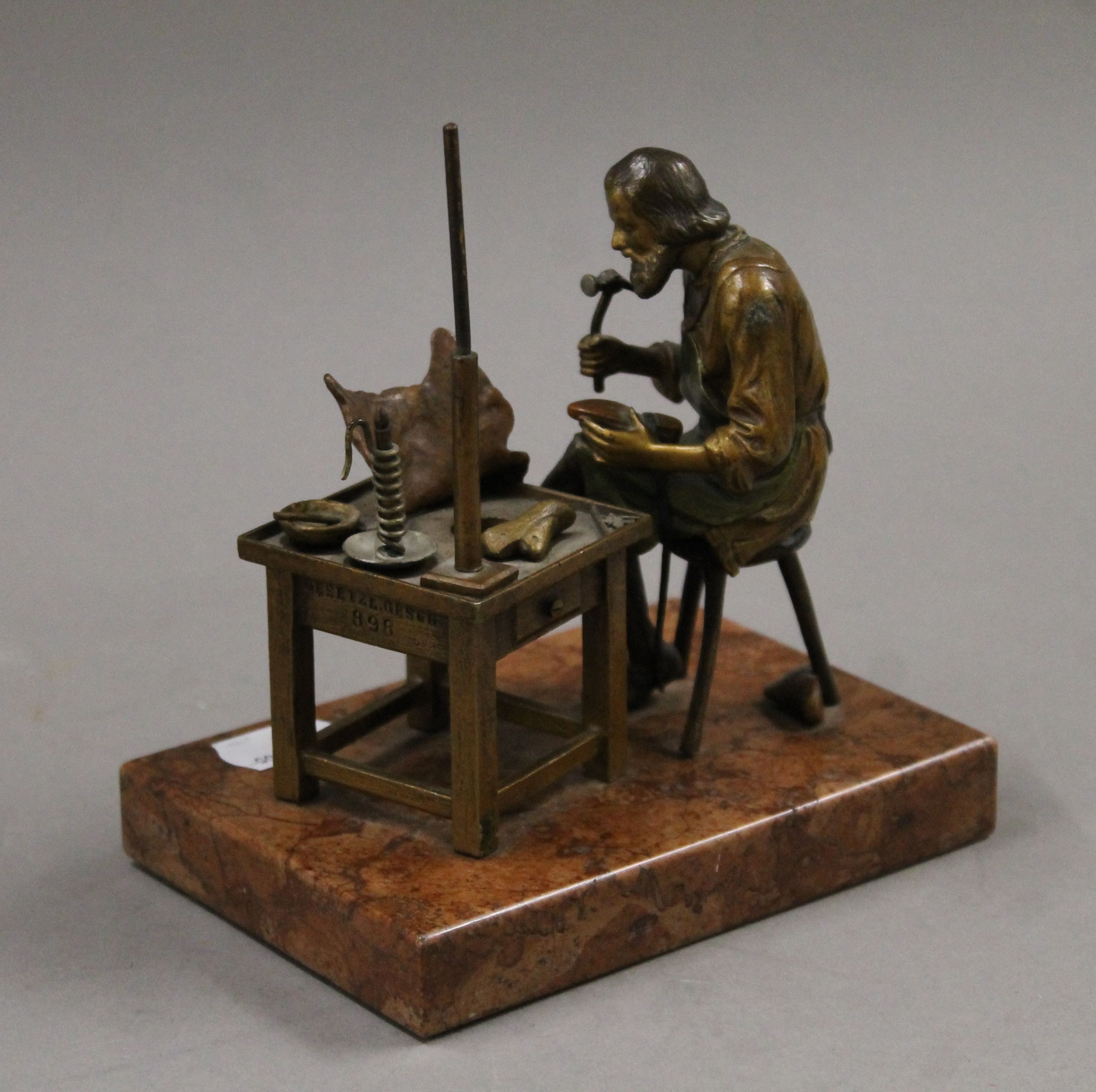 A cold painted bronze model of a cobbler mounted on a rouge marble base. 13.5 cm wide. - Image 3 of 6