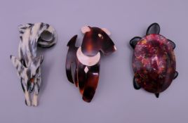 Three Lea Stein brooches.