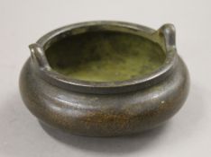 A small Chinese bronze censer. 11 cm diameter.