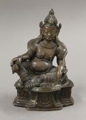 A bronze model of Buddha seated holding a rat. 15.5 cm high.