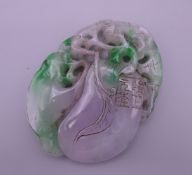 A large green and lilac jade pendant. 9 cm high.