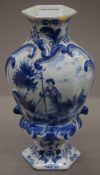 A 19th century Delft blue and white porcelain vase. 24.5 cm high.