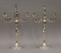 A pair of 800 Continental silver twin-branch candelabra. 43 cm high. 47.8 troy ounces.