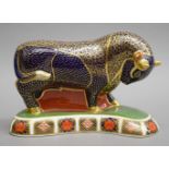 A Royal Crown Derby bull paperweight. 12 cm high.