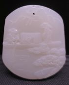 A Chinese white jade pendant. 5.25 cm high.