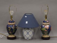 Three decorative porcelain table lamps. The two largest each 54 cm high overall.