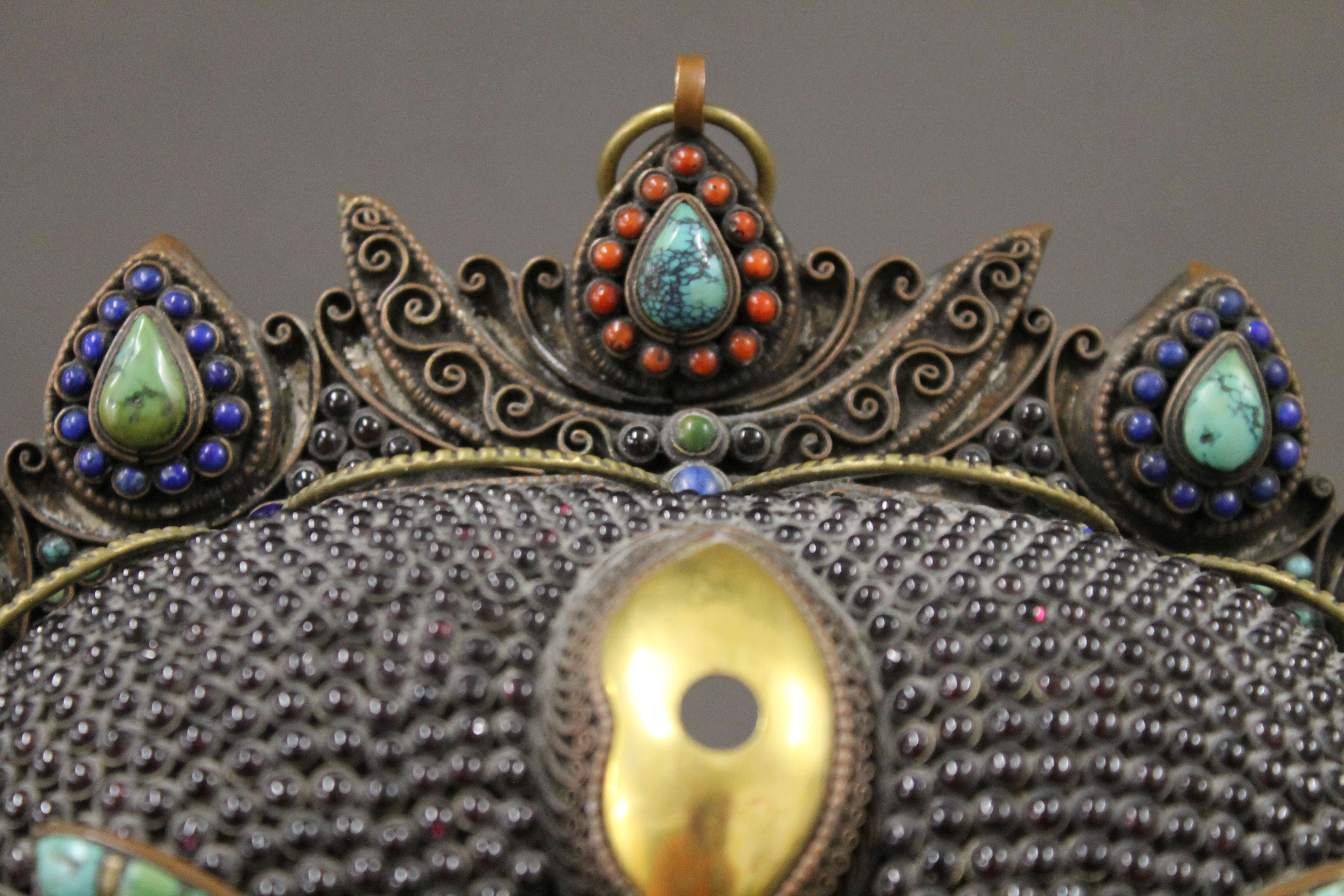 A Tibetan cabochon set copper and brass mask. 23 cm wide. - Image 5 of 5