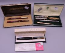 A collection of pens and pencils, including a boxed Parker pen.