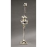 A silver plated oil lamp (converted to electricity). 78 cm high.