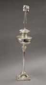 A silver plated oil lamp (converted to electricity). 78 cm high.
