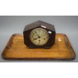 An early 20th century oak mantle clock and an oak tray. The former 26 cm wide.