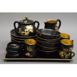 An early 20th century Japanese lacquered tea set. The tray 30 cm wide.