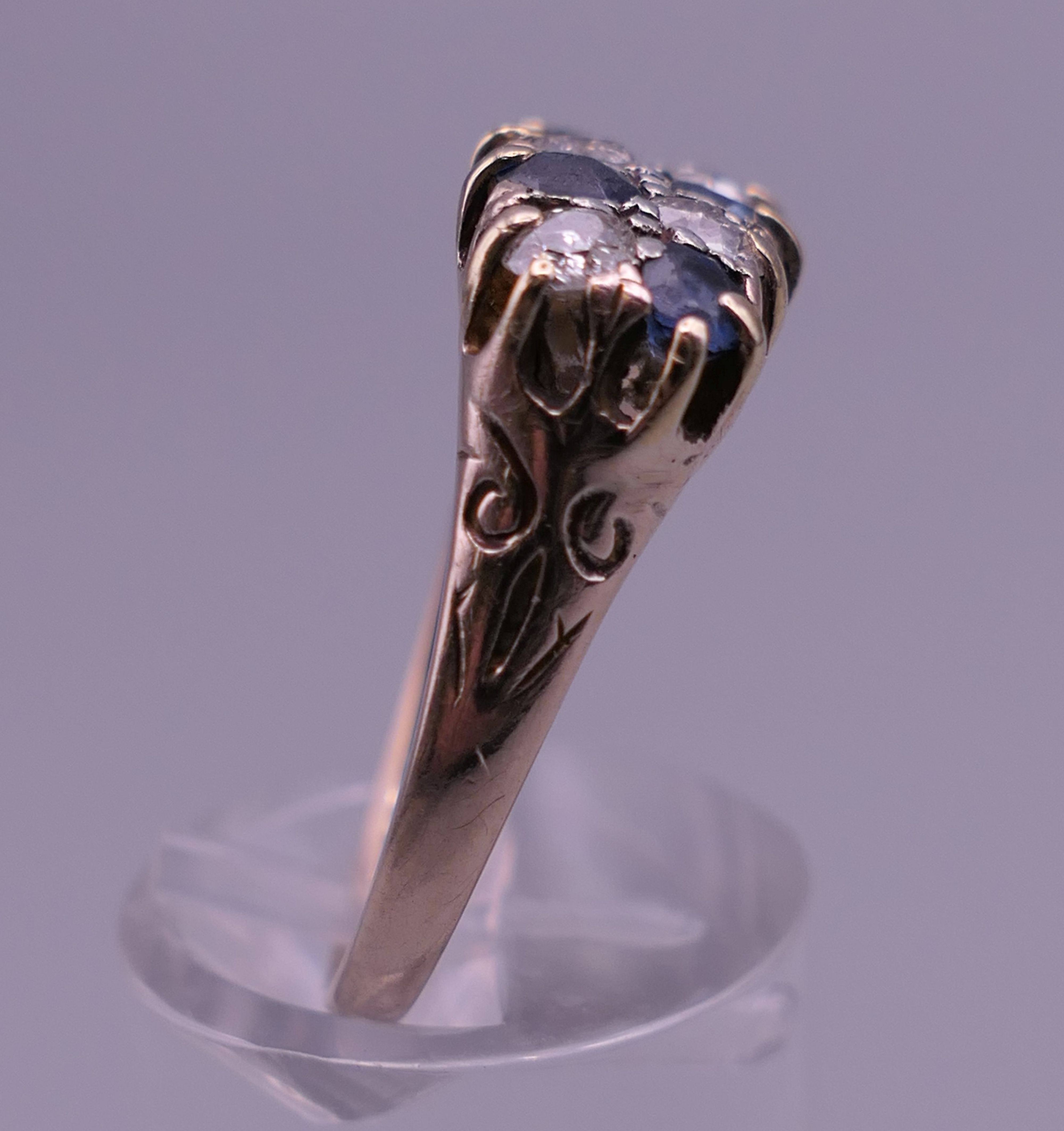 An 18 ct gold diamond and sapphire ring. 8 mm high, 17 mm wide. Ring size Q/R. - Image 2 of 8