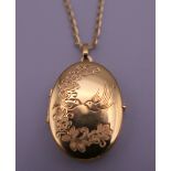 A 9 ct gold locket on chain. Locket 3 cm high, chain 50 cm long. 6.4 grammes total weight.