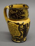 A Royal Doulton jug decorated with cats. 16 cm high.