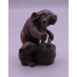 An Oriental rabbit and drum carving. 4.5 cm high.