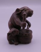 An Oriental rabbit and drum carving. 4.5 cm high.