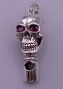 A 925 silver skull whistle. 4 cm high.