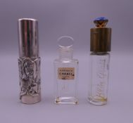 Three perfume bottles, one silver clad (7 cm high).