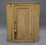 A 19th century pine corner cupboard. 82 cm wide.